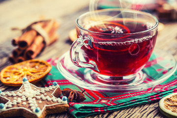 Christmas hot wine or tea drink with orange mandarin star anise cinnamon and gingerbread