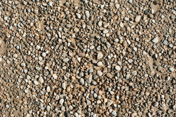 Small and big sand, gravel and pebbles background pattern