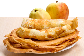 Plate with pancakes and apples