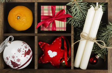 Boxes with gifts for Christmas and various attributes of holiday on a dark background. Top view