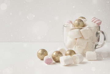 Fototapeta na wymiar Gold Christmas decorations and marshmallow. Winter concept. Christmas composition.