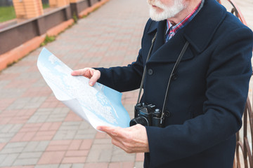 senior tourist with map