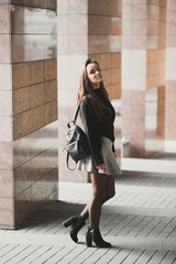 Beautiful young woman posing on the street in old city