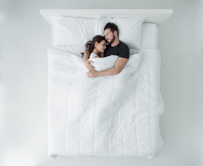 Loving couple in bed