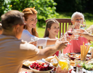 happy family having dinner or summer garden party