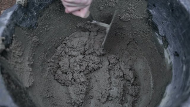 Mixing cement with a trowel
