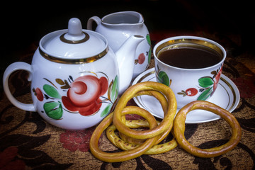 Evening tea ceremony. Kettle, cookies, tea drinks	