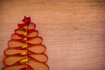 A handmade red christmas tree on a background