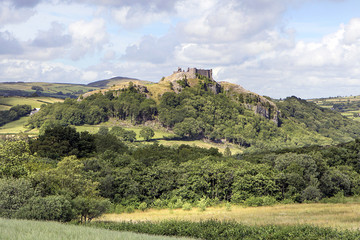 Fototapeta na wymiar Carreg Cennen Castle is situated near the River Cennen in the village of Trap. The castle was surrendered to Owain Glyndwr in 1403 after a siege. It was destroyed after the Wars of the Roses in 1461