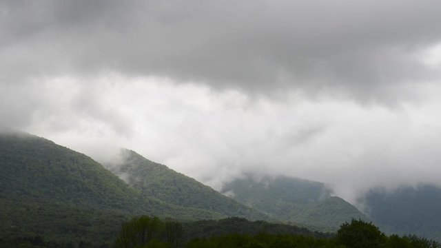 Low clouds moving over the mountains, Klek, Croatia.