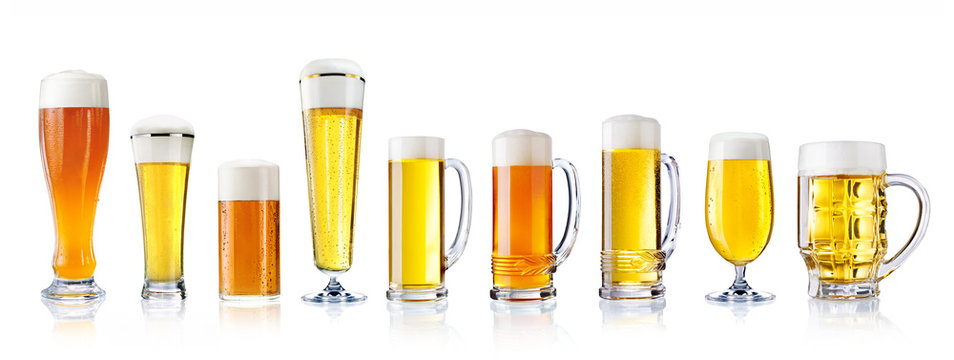various types of fresh beer in glasses isolated on white