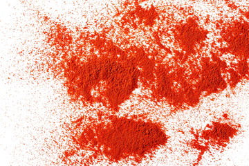 Pile of red paprika powder isolated on white background, top view