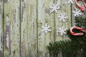 Rustic green Xmas background with real fir branches and star glitters