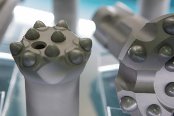 Carbide-tipped drilling rig attachments