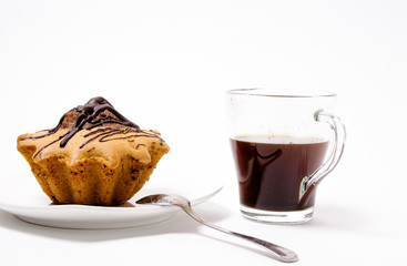 Fresh and flavored cupcake on a white plate with black coffee on a white background