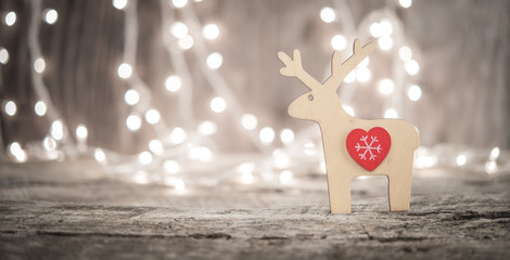 Raindeer ornament and bokeh lightd as christmas or new year background
