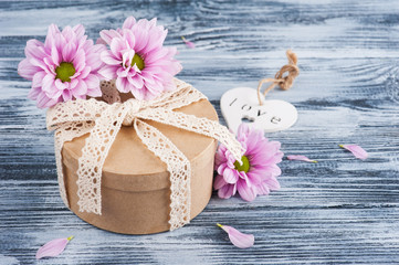 Pink chrysanthemum and gift box