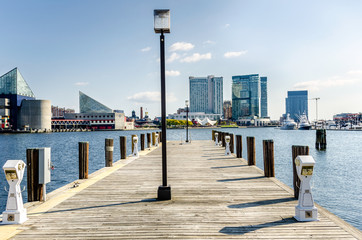 Deserted Wooden Jetty with Electric Sockets and Mooring Posts on a Sunny Fall Day. Baltimore, MD