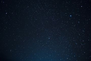 Night scape with beautiful stary sky at the high mountain. Star texture. Space background. - obrazy, fototapety, plakaty