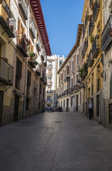 Fototapeta na wymiar A Typical Narrow Street in Madrid Spain
