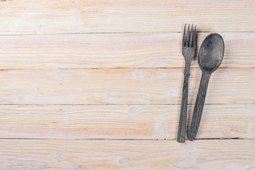 Old cutlery. On a wooden background. Top view. Free space for text.