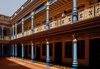 India Tanjore temple blue columns courtyard