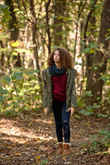 Teen girl in autumn forest
