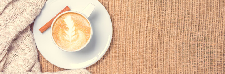 Cup of coffee or chai tea with latte art. Leisure time concept. Pastel colors