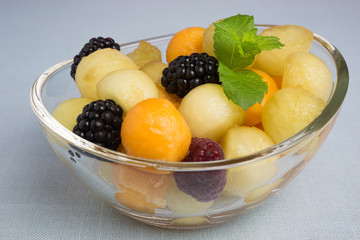 piel de sapo melon and cantaloupe with raspberries and blackberries