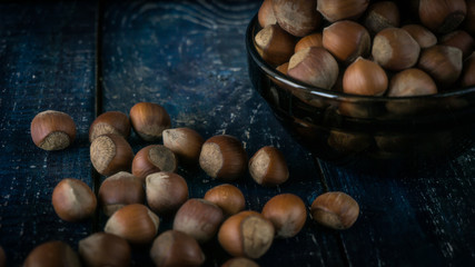 Group of hazelnuts on wooden rustic background