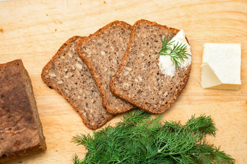 Bread. Tasty, home made, baked, wholegrain, wholemeal, brown bread. with chopped dill, butter and...