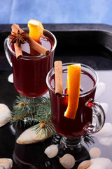 Christmas mulled wine in water, mulled wine with cinnamon and anise, drink with honey, mulled wine glass with seashells in water, retro style, drink with orange slices, pop art style