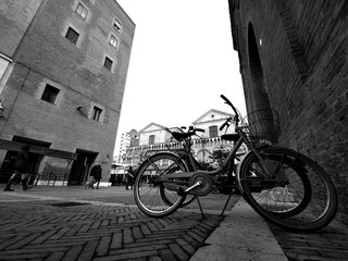 Two bikes and Ferrara city, Italy