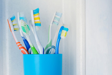 toothbrushes in a glass