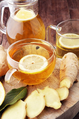 Fototapeta na wymiar Ginger tea in a glass for flu cold winter days.