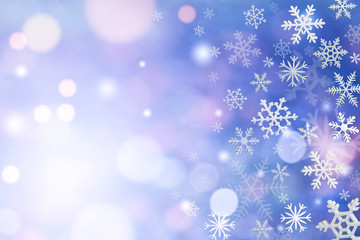 Christmas decoration with snowflakes on defocused blue background.