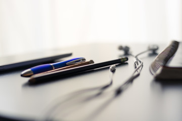 Office desk and the tools used inside the office from the days of yesterday and today. This set of images illustrates the adaption of new technology in the workplace.