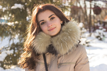 Young beauty woman in winter park