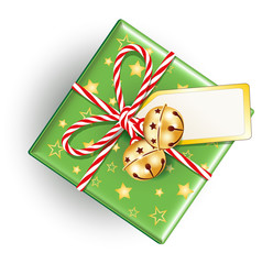 Geschenk mit Kordelschnur, Karte und Glöckchen
Weihnachtsgeschenk mit Schellenglöckchen und Schleife
Vektor Illustration isoliert auf weißem Hintergrund