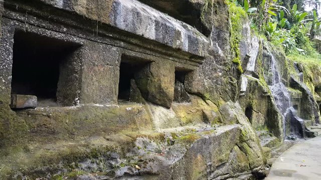 Small waterfall from historic relics at Gunung Kawi Temple, Bali