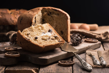 Homemade Panettone. Italian Christmas Cake on a rustic wooden table