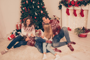 Full length of four cheerful beautiful relatives having fun at home, married couple, mom and dad,...