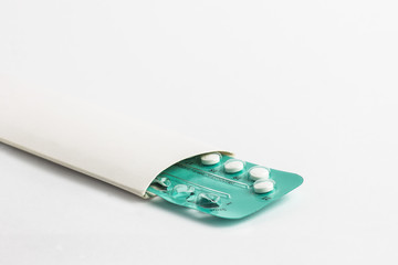 Contraception pills on white background.  Birth control