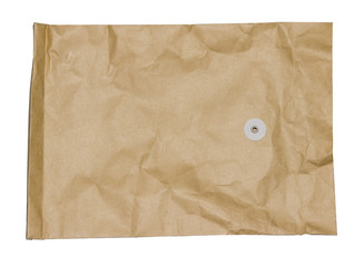 Old brown crumpled paper envelope isolated on white background.