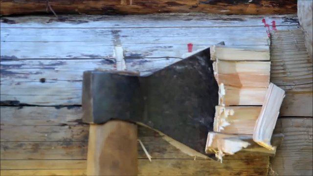 Assembling a wooden frame and building a house. Russia. Texture of old wooden logs, recess in the log for joining for using ax.
