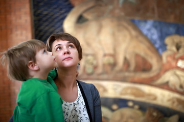 Fototapeta na wymiar Mother with son in museum