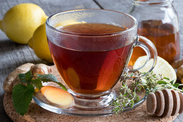 A cup of tea with ginger, lemon and honey