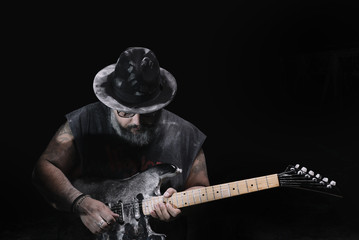 man with the guitar between chalk dust and smoke