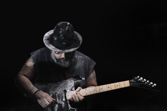man with the guitar between chalk dust and smoke