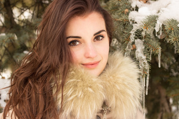 Young woman in winter park